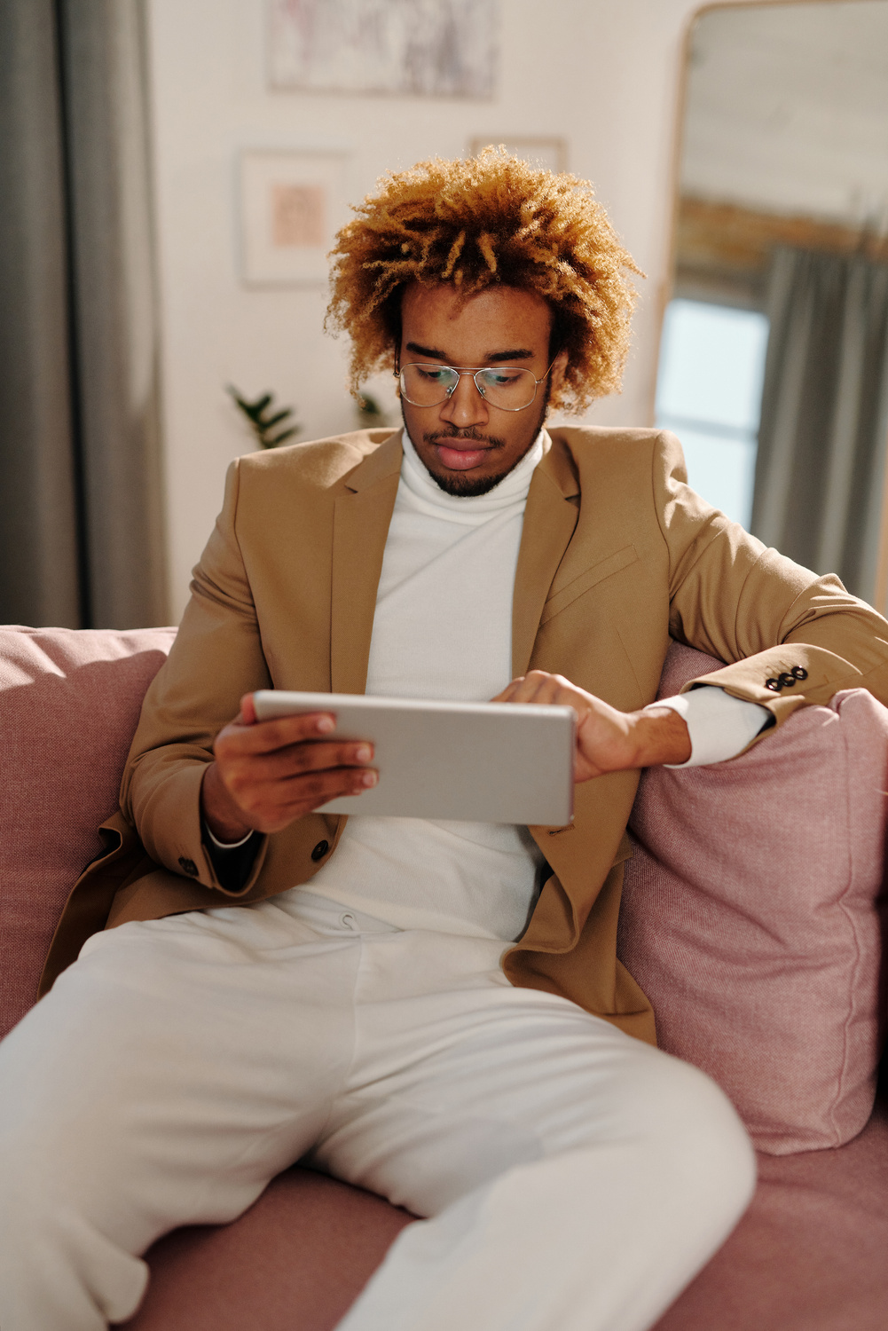 Man in Brown Blazer Holding a Tablet 