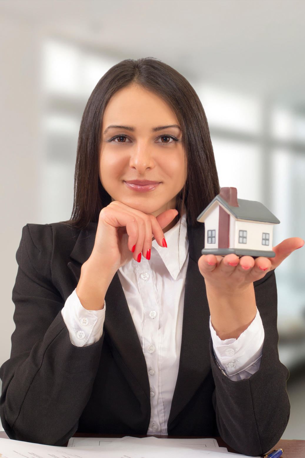 Realtor holding model house